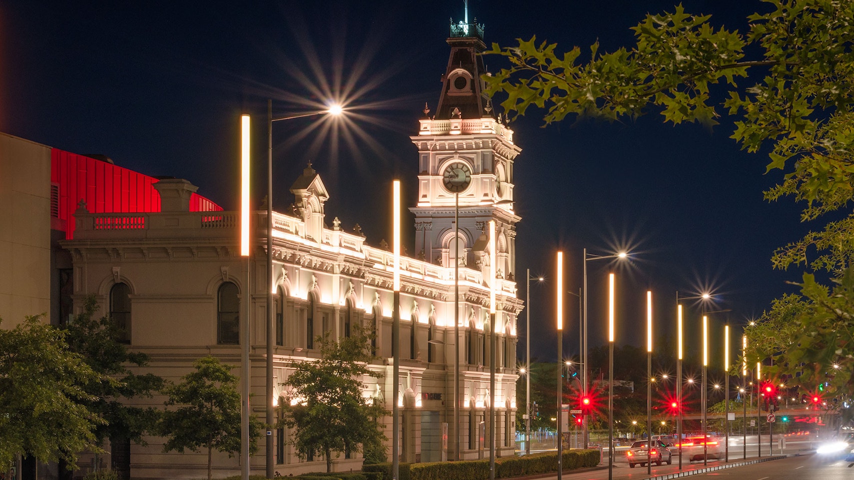 Latitude LED luminaire in application, installed on the façade of the former Dandenong Town Hall, now known as the Drum Theatre in Melbourne. Night view.