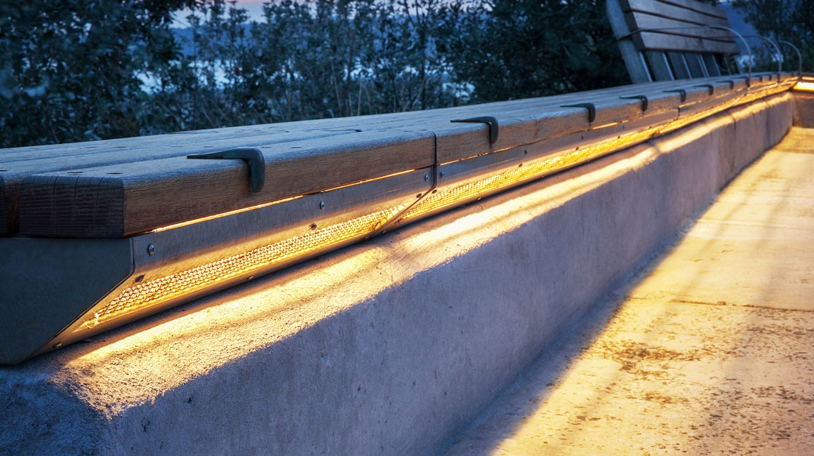 Gap Park in Watsons Bay, NSW features an installation of side-emitting strip lighting to create a continuous warm white glow under the bench seating.