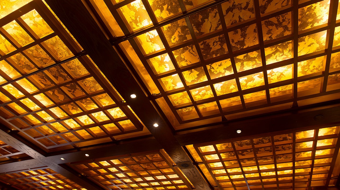 Strip lighting is featured in Koko's feature ceiling. The installation provides CCT dimming, which simulates the behaviour of an incandescent light source by becoming warmer as it dims.