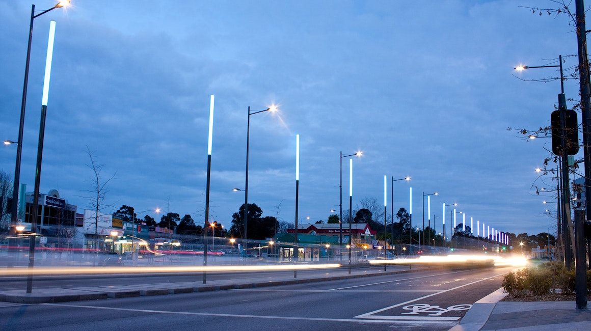 An installation of 68 illuminated colour changing poles lines the Lonsdale Street shopping precinct in Dandenong, Melbourne