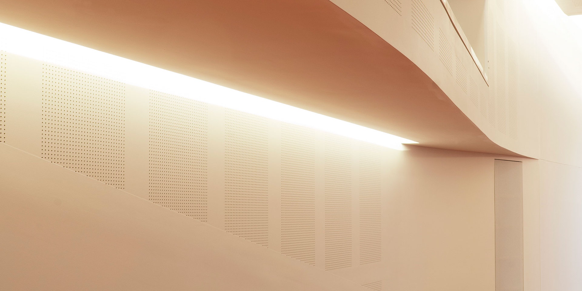 Primo X2 LED strip in application, installed in the Swinburne University AMC Building Lecture Theatre. Multiple soffits create a wave-like effect and double as an indirect lighting source.