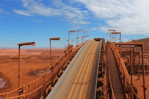 Conveyor belt on an iron ore is illuminated by a range of Coolon fittings.