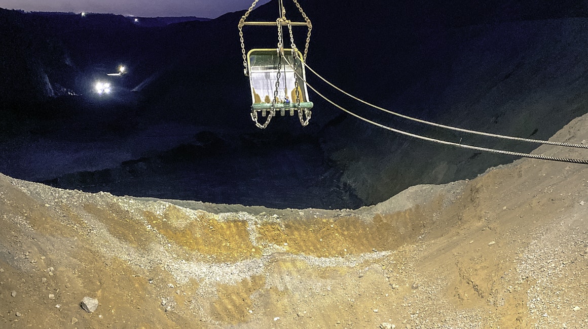 Marion 8050 dragline working at night, lit up with Coolon XBlades.Close up on the shovel.