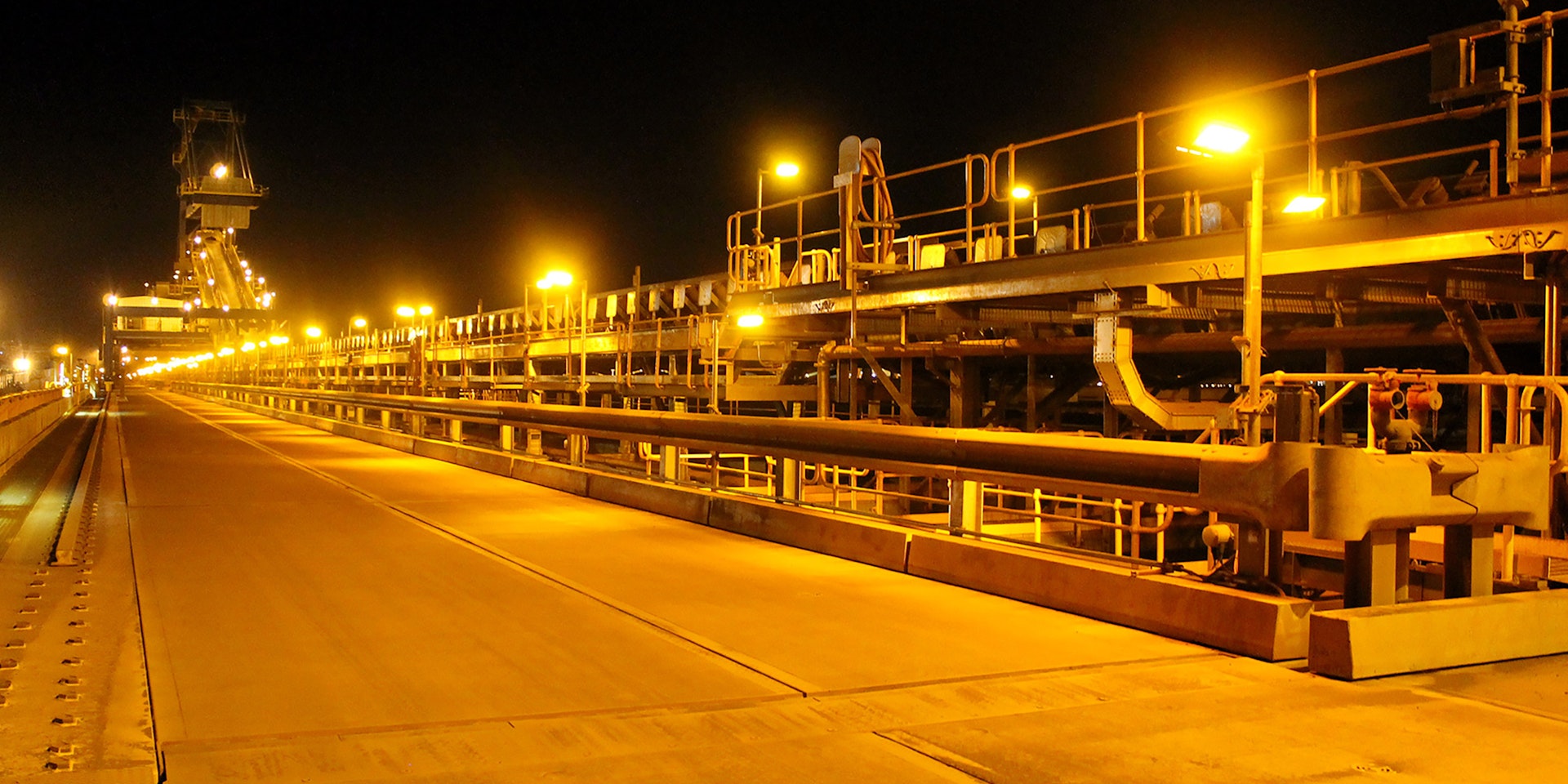 DLK LED Conveyor / Area Light in application, installed on a conveyor on an iron ore mine in bulk port, turtle-friendly amber colour temperature 