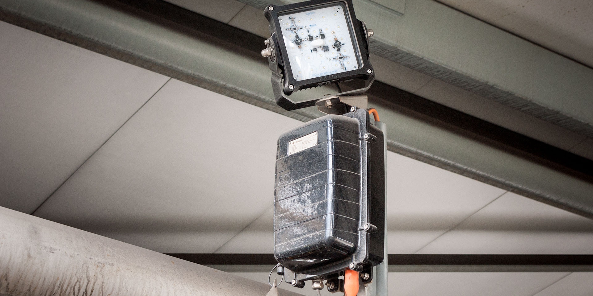 Warden LED Flood Light in application,installed on a wall on an industrial / mine site
